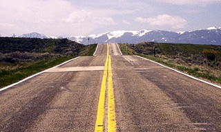 image of two-lane highway representing give and take of business growth
